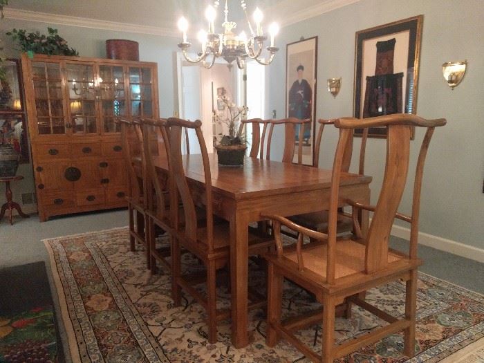 UNBELIEVABLE custom ordered table, hand made in Macau. The table top is a single piece of wood, the chairs are an exact copy of Ming Dynasty chairs (6 sides, 2 arms). Very kid-friendly, as there are four drawers on each side of the table, for their favorite foods, such as beets, brussel sprouts, sauerkraut, broccoli, cauliflower, braunschweiger, liver, etc. They just open the drawer when you're not looking and, voila, they have cleaned their plate and earned pudding for dessert!