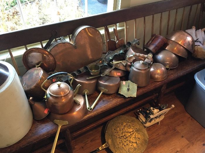 Tons and tons of antique copper pots and cookware