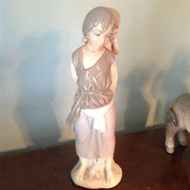 Lladro lady with baby on her back $ 60.00