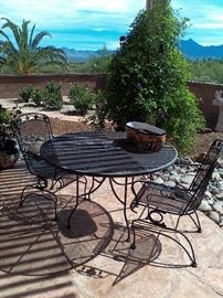 Metal table with 2 chairs.