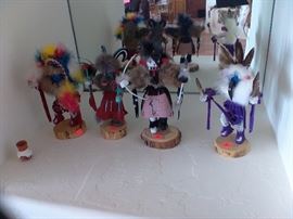 More small Kachina dolls.