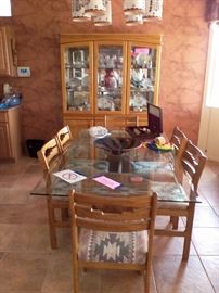 Oak glass top dining table with 6 chairs.