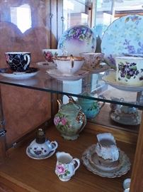 Bone china tea cups, plates, and pot
