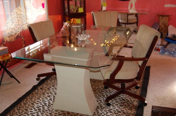 Glass dining room table, (3) chairs and animal print rug