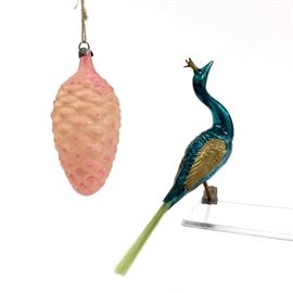 lot of 2 Antique Dresden Christmas ornaments. 1 antique mercury glass peacock with spun glass tail in good condition with wear consistent with age and use. Bird is marked Germany. One mercury glass handmade pink pine cone ornament. Estimated value $75