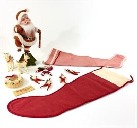 Lot #0018: Lot of 12 1920s & 1930s Christmas Decor items. Four Chenille and papier-mâché Santa ornament figures, Two Vintage Plastic Reindeer, Two Antique handmade stockings, One 10 inch Santa figure, and two Santa ornaments. 