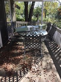 Outdoor glass top iron table,chairs, cushions, and umbrella