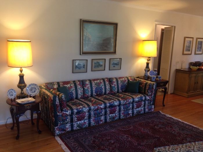 Charming, cozy and inviting living room, upholstered sofa, "oriental rugs."