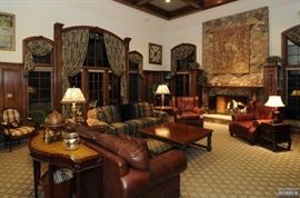 Leather sofa, pair of leather chairs, tapestry, large coffee table, Adam's style leather top console table