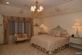 French style king size headboard, two painted chests, antique gilt loveseat, antique bronze chandelier