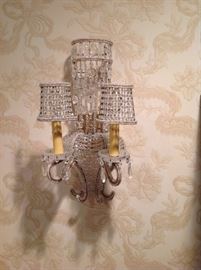 One of a pair of beaded two light sconces