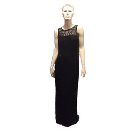 Size: 6 (est.)

Black floor length evening gown with black beading on dress and blue/purple around neckline.