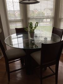 Belfort Table with wine rack underneath and 4 chairs