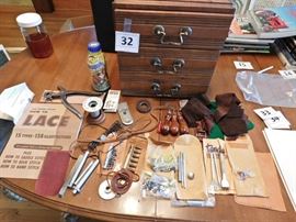 small 3 drawer unit filled with many very nice leather worker's tools and supplieas