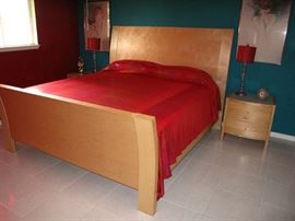 Palliser Furniture Mfg. Canada Mid-Century Style Natural Finish Sleigh Style King Size bed Shown with 1 of 2, 2-drawer Night Stands with White Glass Tops. Bed has a Like New Simmons Beautyrest Mattres Set and a Memory Foam Mattress Topper.