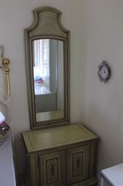 One of two matching night stands and mirrors.