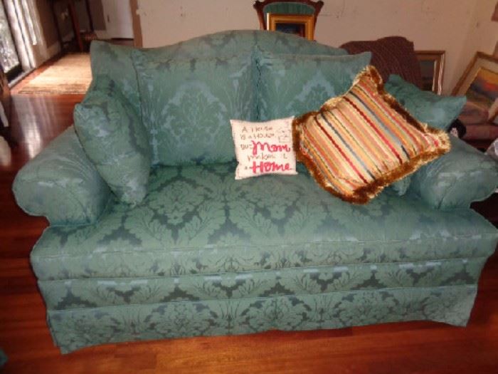 Teal and greenish Baker couch with 6 throw pillows
-Comes with 6 throw pillows: 1 striped colorful, 4 greenish teal, 1 "A house is a house but mom makes it a home"
70"W x 39"D x 36"H
Matches #171
