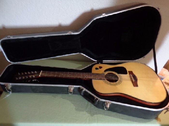 Fender guitar and black fender hard case

Good shape! Fender light and dark wood acoustic guitar

Black fender hard case