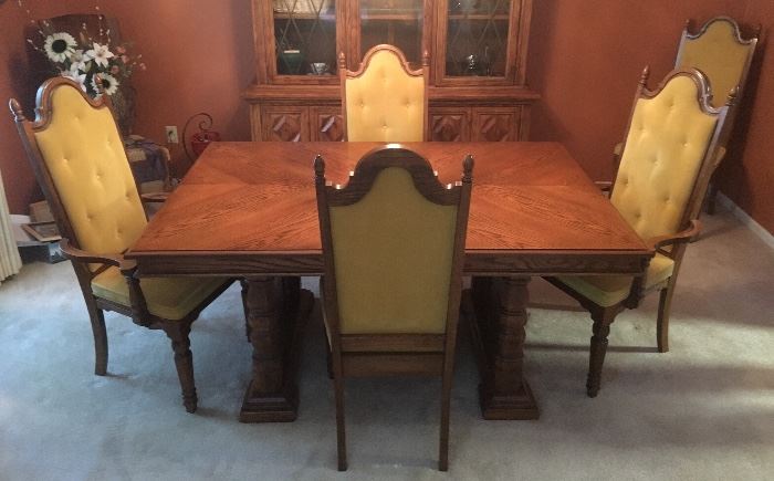 Elegant dining room set, includes table, leaves, 4 chairs, 2 captain's chairs and large china cabinet.