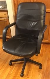 Executive,  adjustable office chair. 