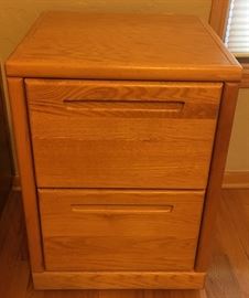 Two drawer, wooden file cabinet.