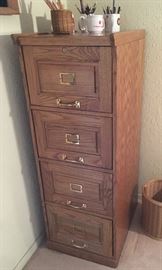 Four drawer, legal wooden file cabinet.