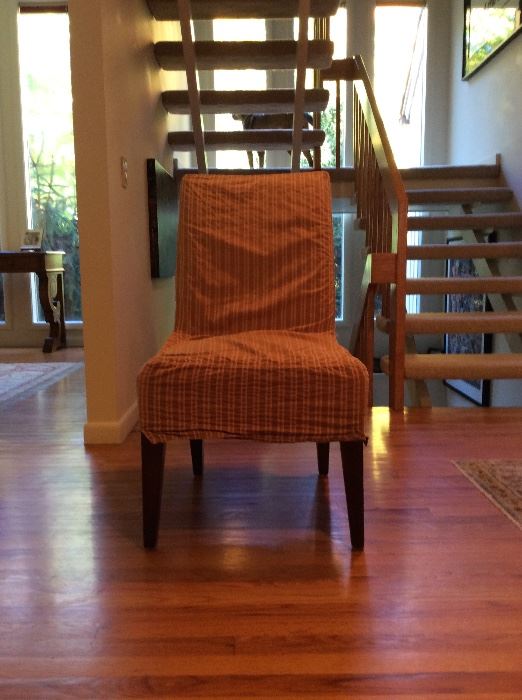 6 red and tan striped slip covered dining chairs. ($450)