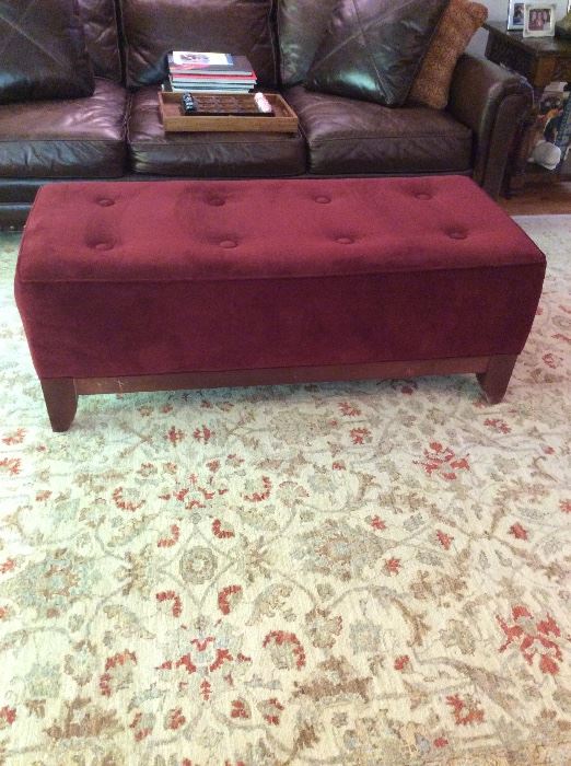 Cranberry colored velvet foot rest/bench. Measures 51 inches long x 23 inches wide x 18 inches tall. ($500)