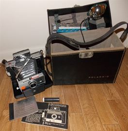 Polaroid camera in box with accessories