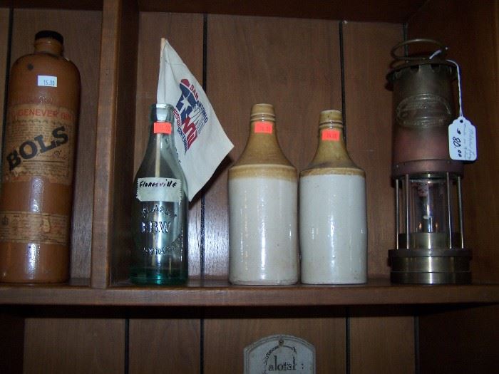 Brass lantern, stoneware bottles