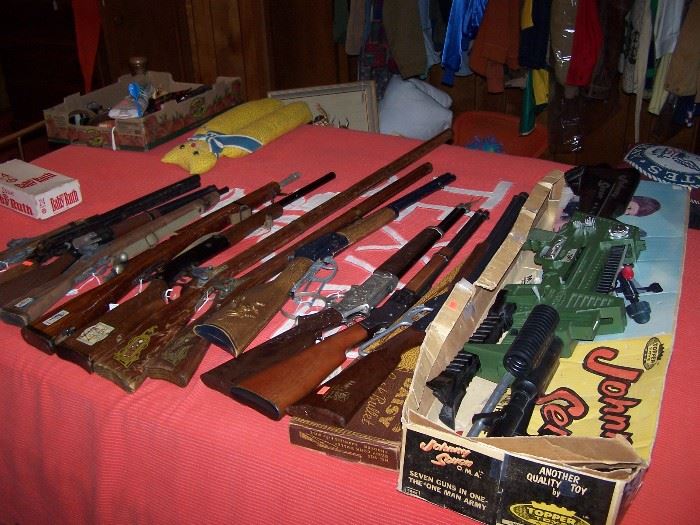 Toy guns including Johnny Seven one man army, Kadet trainer rifles, Mattel Winchester saddle gun, "The Rifleman" rifle, U. T. bed spread
