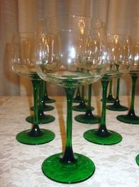Crystal wine glasses; green stems