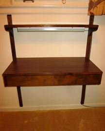 Mid Century Kopenhavn wall mount desktop with drawer.  Has upper shelf with light (which probably isn't original to the piece).  33" wide