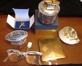 Vintage lighters, compacts eyeglasses frames.