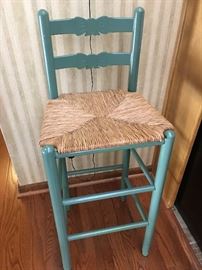 Three (3) green raffia bar stools