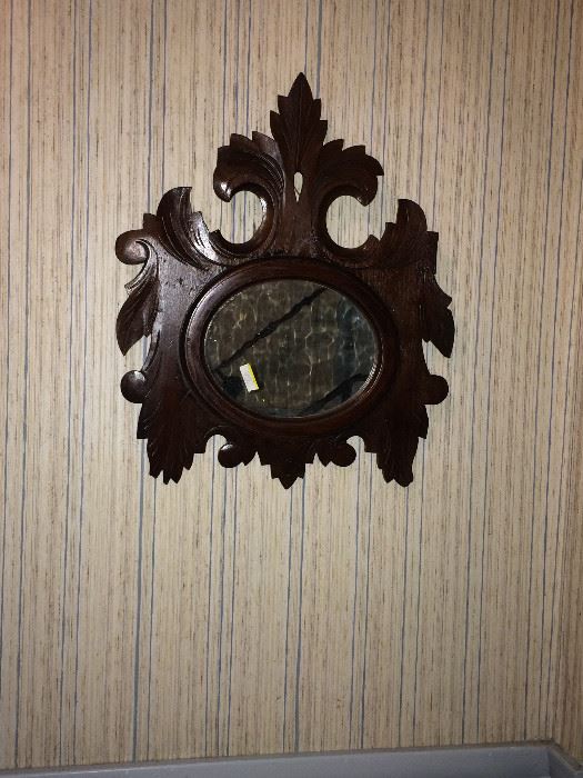 This an early framed, Victorian mirror. The entire back is a single board.