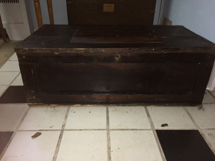 This is a very old tool chest , with tools and brass corners.  This is as found and the brass is not polished.