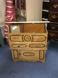 This a lift top commode with original paint and shown with the top open. Within the antique field