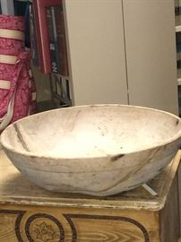 This is about. 20"-21 1/2 "  bowl with interesting butterfly repairs on the bottom. This looks to be early 19 th century. The bowl has become an oval from natural shrinkage with age.