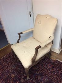 This a late 19 century (or earlier) chair with good carving and ready to be covered. The chair is sound and has the muslin all ready for recovering.