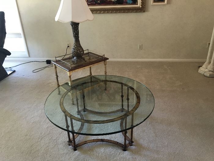 Vintage heavy glass coffee and end table with brass base.  