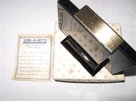 serv-o-rette cigarette dispenser.