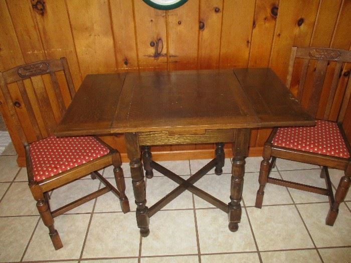 Vintage gang table with matching chairs.