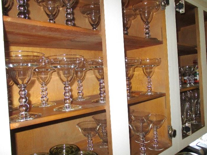 The glassware includes sherberts and cordial glasses