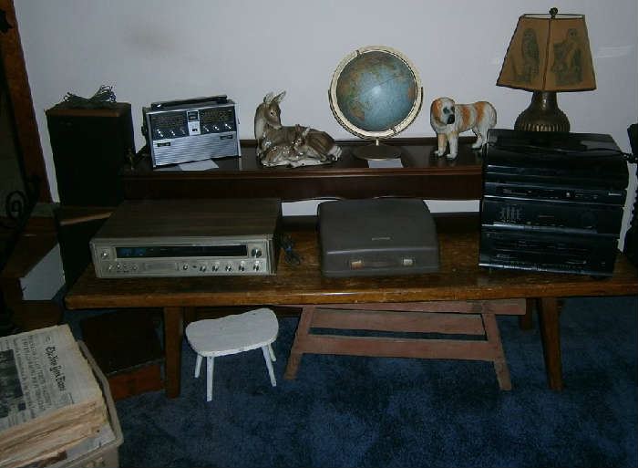Old Fisher stereo, royal typewriter, all-in-one stereo, Montgomery Ward radio, vintage Globe (approx. 1954), wood benches, mother deer and baby figurine, large dog figurine and small wooden benches.