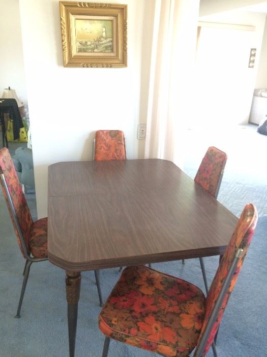 Mid Century table w/leaf and four vinyl chairs