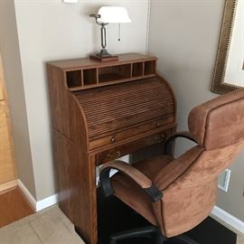 rolltop computer desk, floor mat, office chair, lamp