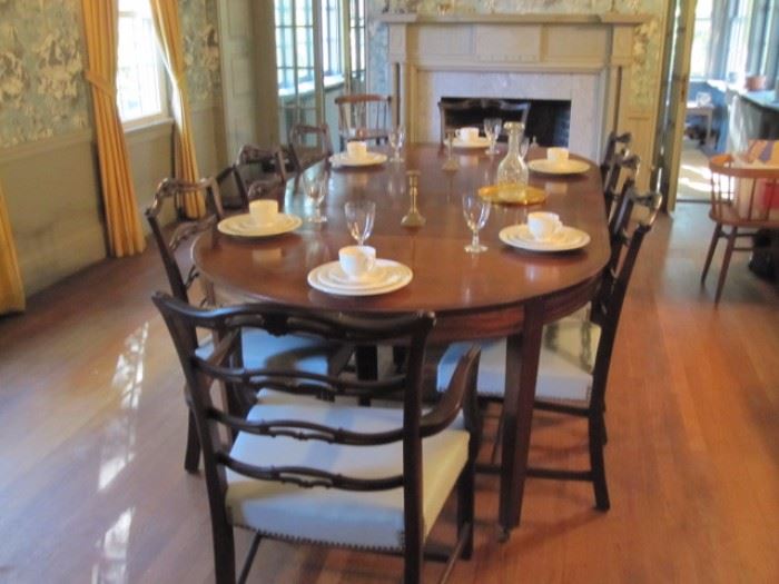 Stunning antique dining room table with (8) chairs.