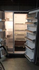Whirlpool side-by-side refrigerator, clean inside and works great