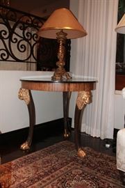 Wood side table with lion head embellishment              32 " round 